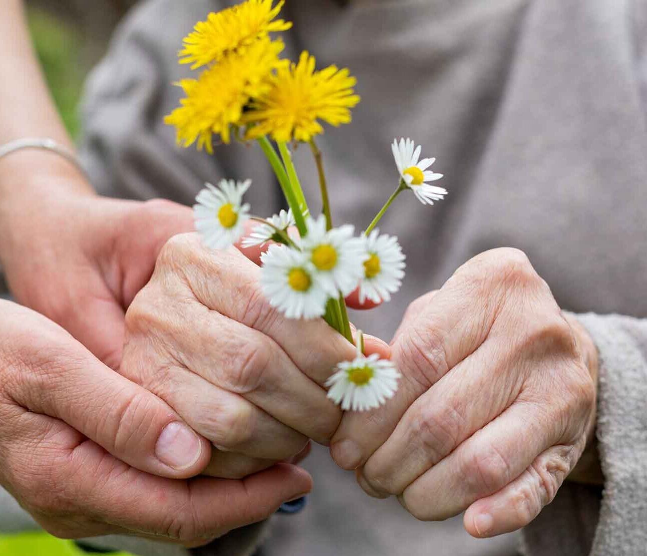 Resident holding flowers